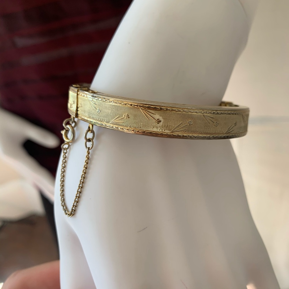 Antique carved petite gold tone bangle